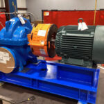Pair of Goulds 3410 split-case pumps with 50 HP motors mounted on engineered carbon steel bases with Uniguard barrel-style pump guards